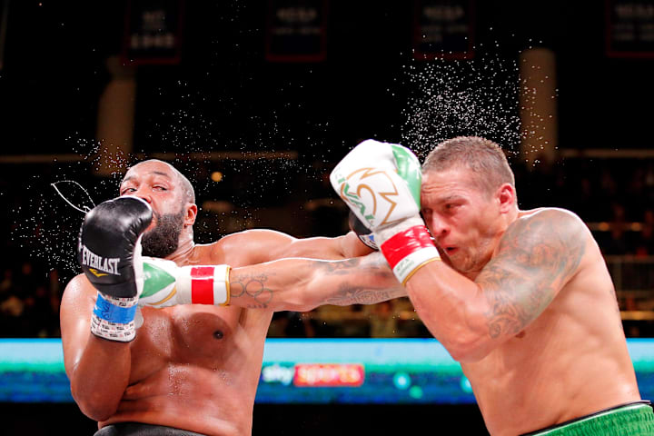 Oleksandr Usyk and Chazz Witherspoon box during a heavyweight boxing match at Wintrust Arena. 