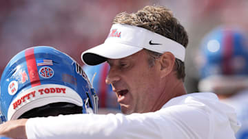 Oct 18, 2025; Athens, Georgia, USA; Mississippi Rebels head coach Lane Kiffin talks with Mississippi Rebels wide receiver Deuce Alexander (11) prior to the game against the Georgia Bulldogs at Sanford Stadium. Mandatory Credit: Dale Zanine-Imagn Images