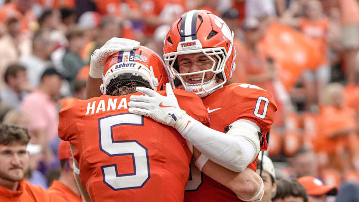 Clemson defensive back Ronan Hanafin (5) is congratulated by linebacker Jamal Anderson (0) after his interception against Troy during the third quarter at Memorial Stadium in Clemson, S.C. Saturday, September 6, 2025.