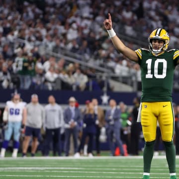 Green Bay Packers quarterback Jordan Love (10) reacts after a touchdown against the Dallas Cowboys during the 2023 playoffs.