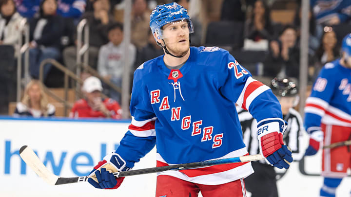 Apr 5, 2026; New York, New York, USA; New York Rangers defenseman Adam Fox (23) skates against the Washington Capitals during the second period at Madison Square Garden.