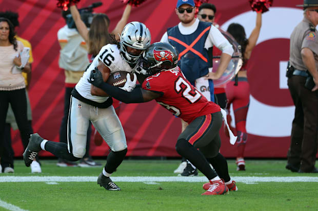  Las Vegas Raiders wide receiver Jakobi Meyers (16) runs with the ball as Tampa Bay Buccaneers safety Tykee Smith