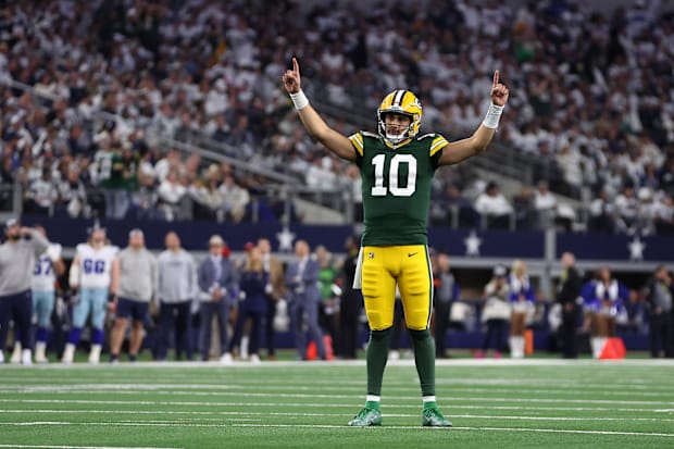 Packers quarterback Jordan Love (10) reacts after a touchdown against the Dallas Cowboys during the wild-card playoffs.