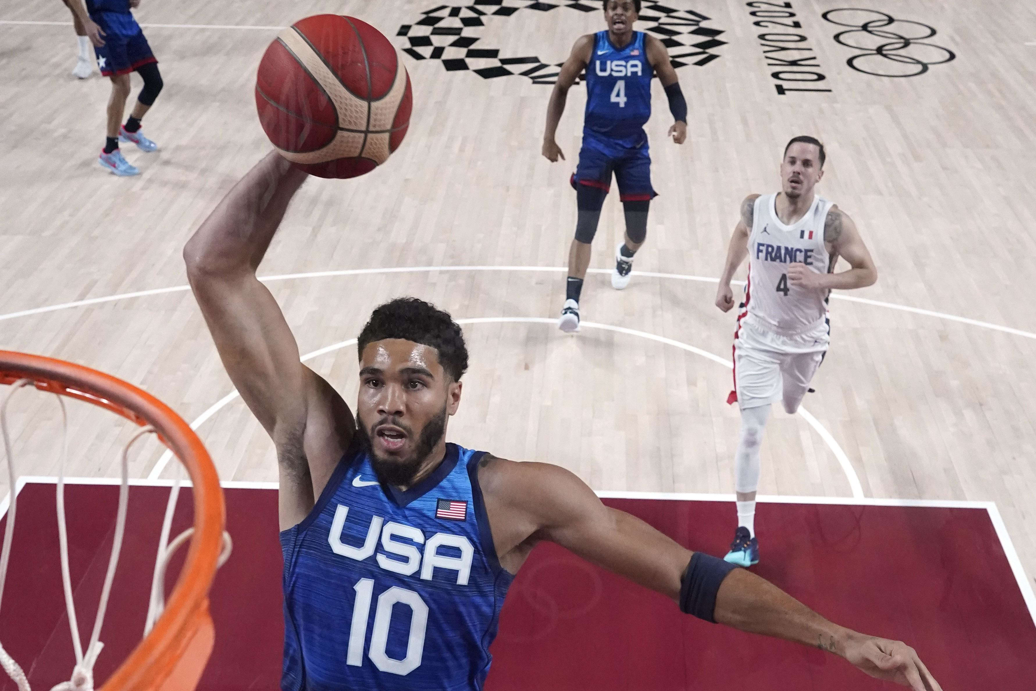 Team USA forward Jayson Tatum dunks the ball.