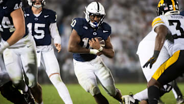 Penn State football running back Nicholas Singleton carries the ball during the second half of a White Out football game against Iowa Saturday, Sept. 23, 2023