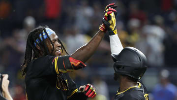 Jul 3, 2024; Pittsburgh, Pennsylvania, USA;  Pittsburgh Pirates shortstop Oneil Cruz (left) celebrates with designated hitter Andrew McCutchen (22) after Cruz hit a game winning walk off single to win the game against the St. Louis Cardinals in ten innings at PNC Park. The Pirates won 5-4 in ten innings. Mandatory Credit: Charles LeClaire-USA TODAY Sports