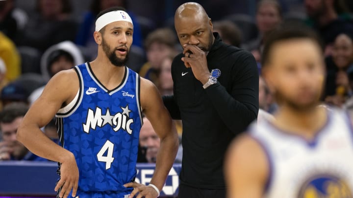 Jan 2, 2024; Orlando Magic head coach Jamahl Mosley and guard Jalen Suggs (4) confer during the first quarter against the Golden State Warriors at Chase Center.