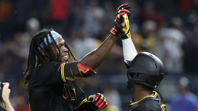 Jul 3, 2024; Pittsburgh, Pennsylvania, USA;  Pittsburgh Pirates shortstop Oneil Cruz (left) celebrates with designated hitter Andrew McCutchen (22) after Cruz hit a game winning walk off single to win the game against the St. Louis Cardinals in ten innings at PNC Park. The Pirates won 5-4 in ten innings. Mandatory Credit: Charles LeClaire-USA TODAY Sports