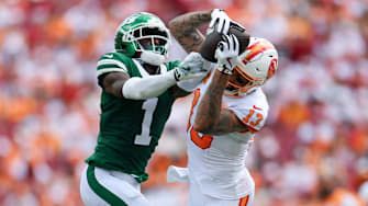 Sep 21, 2025; Tampa, Florida, USA; Tampa Bay Buccaneers wide receiver Mike Evans (13) catches pass defended boy New York Jets cornerback Sauce Gardner (1) in the third quarter at Raymond James Stadium. 