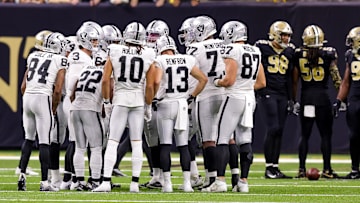 Oct 30, 2022; New Orleans, Louisiana, USA;  Las Vegas Raiders quarterback Jarrett Stidham (3) calls a play in the huddle against the New Orleans Saints during the second half at Caesars Superdome. Mandatory Credit: Stephen Lew-Imagn Images