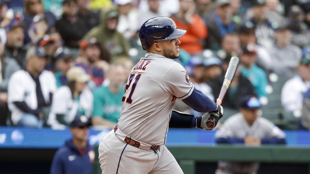 Apr 13, 2026; Seattle, Washington, USA; Houston Astros catcher Yainer Diaz (21) hits an RBI-single against the Seattle Mariners during the fifth inning at T-Mobile Park. Mandatory Credit: Joe Nicholson-Imagn Images