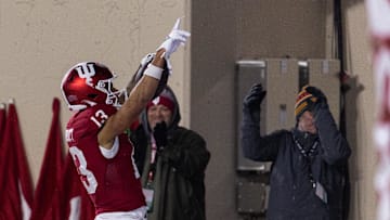 Nov 30, 2024; Bloomington, Indiana, USA; Indiana Hoosiers wide receiver Elijah Sarratt (13) celebrates his  touchdown in the first half against the Purdue Boilermakers at Memorial Stadium. Mandatory Credit: Trevor Ruszkowski-Imagn Images