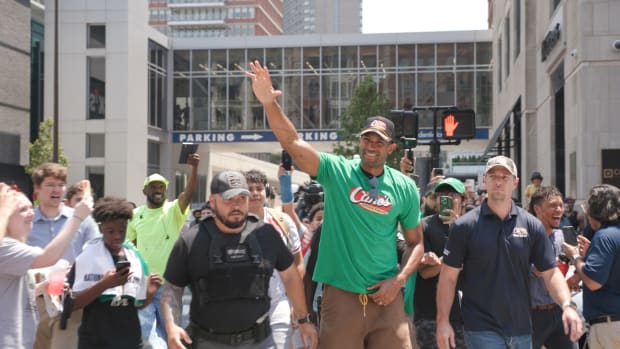 Al Horford waves to fans as he arrives at Raising Cane's on Boylston Street in Boston, MA.