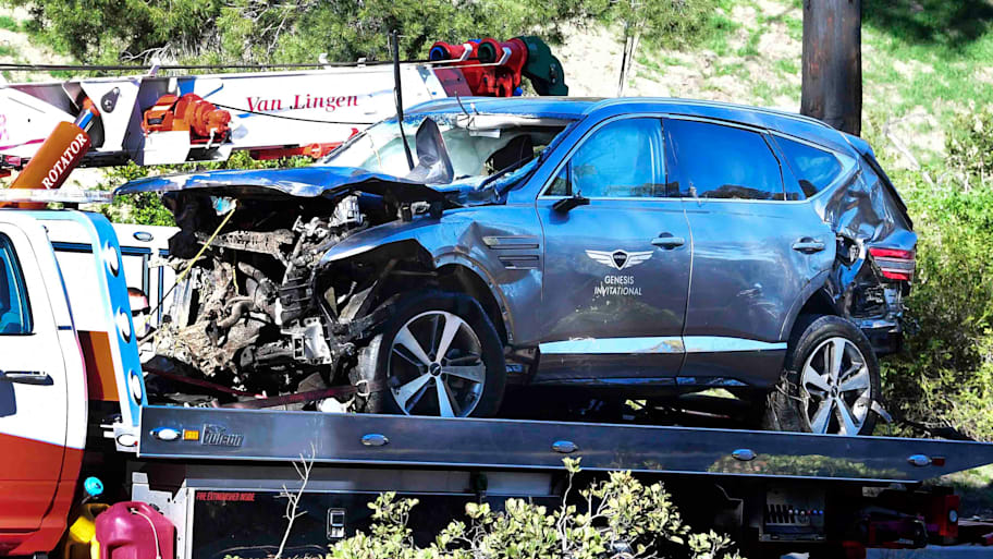 A tow truck recovers the vehicle driven by Tiger Woods in Rancho Palos Verdes, Calif., on Feb. 23, 2021, after an accident.