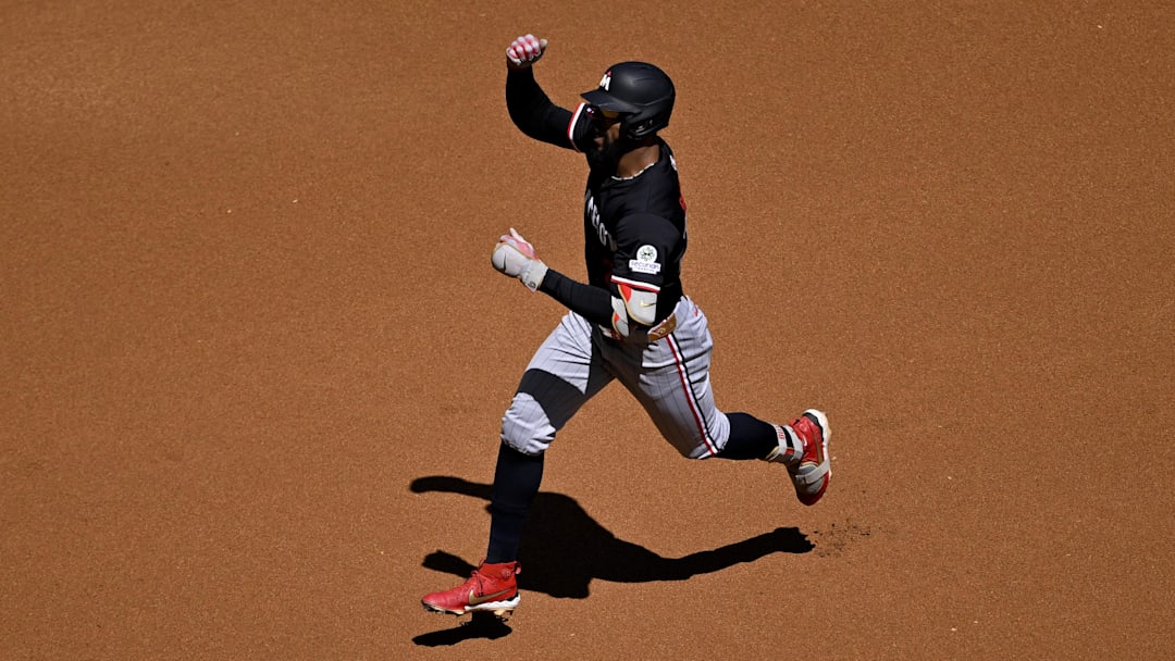 Sep 25, 2025; Arlington, Texas, USA; Minnesota Twins center fielder Byron Buxton (25) rounds second base after he hits a leadoff home run against the Texas Rangers during the first inning at Globe Life Field. Mandatory Credit: Jerome Miron-Imagn Images