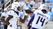 Sep 21, 2024; Chapel Hill, North Carolina, USA; James Madison Dukes wide receiver Cam Ross (1) celebrates with quarterback Alonza Barnett III (14) after scoring a touchdown in the second quarter at Kenan Memorial Stadium. Mandatory Credit: Bob Donnan-Imagn Images