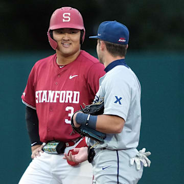 Mar 1, 2025; Stanford, CA, USA; Stanford Cardinal first baseman Rintaro Sasaki (3) talks with Xavier Musketeers second baseman Nolan Tucker (right) during the third inning at Sunken Diamond. Mandatory Credit: Darren Yamashita-Imagn Images