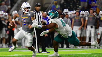 Dec 23, 2023; Honolulu, HI, USA; San Jose State Spartans quarterback Chevan Cordeiro (2) scrambles away from Coastal Carolina Chanticleers defensive lineman Will Whitson (44) during the third quarter of the Easypost Hawaii Bowl at Clarence T.C. Ching Athletics Complex. Mandatory Credit: Steven Erler-Imagn Images