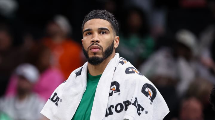 Mar 17, 2024; Washington, District of Columbia, USA; Boston Celtics forward Jayson Tatum (0) looks on from the bench against the Washington Wizards during the second half of the game at Capital One Arena. 