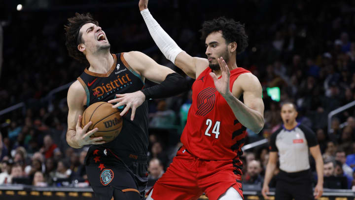 Apr 5, 2024; Washington, District of Columbia, USA; Washington Wizards forward Deni Avdija (8) drives to the basket as Portland Trail Blazers forward Justin Minaya (24) defends in the second half at Capital One Arena. Mandatory Credit: Geoff Burke-USA TODAY Sports