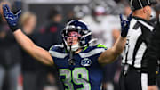 Oct 20, 2025; Seattle, Washington, USA; Seattle Seahawks safety Ty Okada (39) celebrates after sacking Houston Texans quarterback C.J. Stroud (7) during the fourth quarter at Lumen Field.