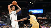 Nov 16, 2025; Washington, District of Columbia, USA;  Brooklyn Nets forward Michael Porter Jr. (17) looks to pass over Washington Wizards guard Bilal Coulibaly (0) during the first quarter at Capital One Arena. Mandatory Credit: Rafael Suanes-Imagn Images