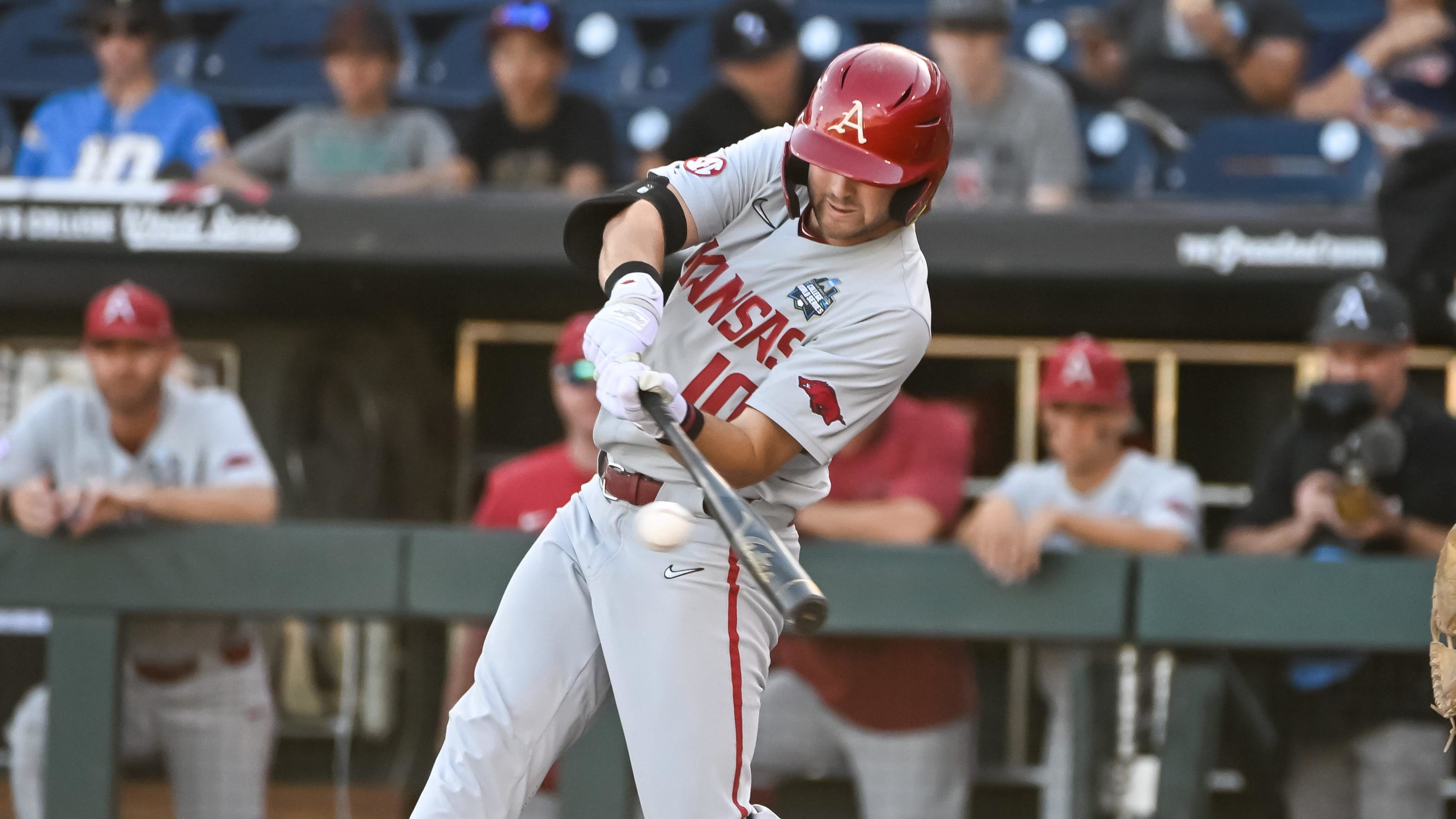 Jun 21, 2022; Omaha, NE, USA;  Arkansas Razorbacks first baseman Peyton Stovall (10) drives in a run