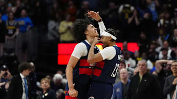Mar 15, 2025; Denver, Colorado, USA; Washington Wizards guard Jordan Poole (13) celebrates his game winning three-point basket with forward Kyshawn George (18) in the fourth quarter against the Denver Nuggets at Ball Arena. Mandatory Credit: Ron Chenoy-Imagn Images