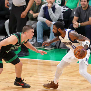 Jun 9, 2024; Boston, Massachusetts, USA; Dallas Mavericks guard Kyrie Irving (11) controls the ball against Boston Celtics guard Payton Pritchard (11) during the second quarter in game two of the 2024 NBA Finals at TD Garden. Mandatory Credit: Peter Casey-USA TODAY Sports