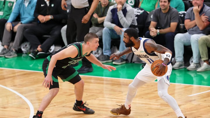 Jun 9, 2024; Boston, Massachusetts, USA; Dallas Mavericks guard Kyrie Irving (11) controls the ball against Boston Celtics guard Payton Pritchard (11) during the second quarter in game two of the 2024 NBA Finals at TD Garden. Mandatory Credit: Peter Casey-USA TODAY Sports