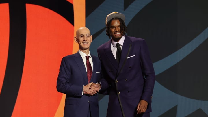 Jun 26, 2024; Brooklyn, NY, USA; DaRon Holmes ll poses for photos with NBA commissioner Adam Silver after being selected in the first round by the Phoenix Suns in the 2024 NBA Draft at Barclays Center. Mandatory Credit: Brad Penner-USA TODAY Sports