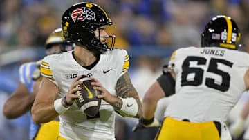 Nov 8, 2024; Pasadena, California, USA;   Iowa Hawkeyes quarterback Brendan Sullivan (1) sets to pass in the first half against the UCLA Bruins at the Rose Bowl. Mandatory Credit: Jayne Kamin-Oncea-Imagn Images