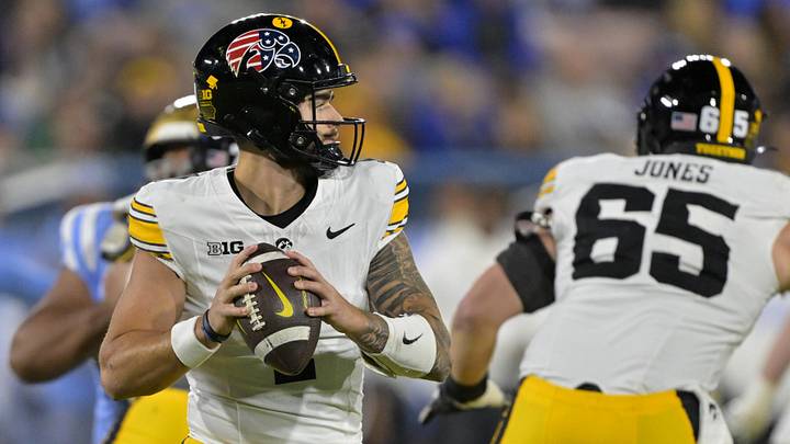 Nov 8, 2024; Pasadena, California, USA;   Iowa Hawkeyes quarterback Brendan Sullivan (1) sets to pass in the first half against the UCLA Bruins at the Rose Bowl. Mandatory Credit: Jayne Kamin-Oncea-Imagn Images