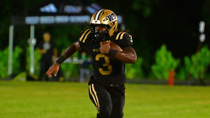 West Boca Raton football's Javian Mallory (3) runs during a win over Benjamin on Thursday, Aug. 22, 2024.