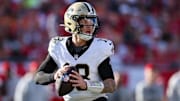 Jan 5, 2025; Tampa, Florida, USA; New Orleans Saints quarterback Spencer Rattler (18) drops back to pass against the Tampa Bay Buccaneers in the fourth quarter at Raymond James Stadium. Mandatory Credit: Nathan Ray Seebeck-Imagn Images