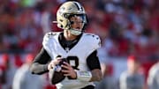 Jan 5, 2025; Tampa, Florida, USA; New Orleans Saints quarterback Spencer Rattler (18) drops back to pass against the Tampa Bay Buccaneers in the fourth quarter at Raymond James Stadium. Mandatory Credit: Nathan Ray Seebeck-Imagn Images