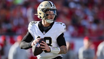 Jan 5, 2025; Tampa, Florida, USA; New Orleans Saints quarterback Spencer Rattler (18) drops back to pass against the Tampa Bay Buccaneers in the fourth quarter at Raymond James Stadium. Mandatory Credit: Nathan Ray Seebeck-Imagn Images