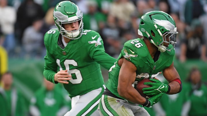 Dec 29, 2024; Philadelphia, Pennsylvania, USA; Philadelphia Eagles quarterback Tanner McKee (16) hands off to running back Saquon Barkley (26) against the Dallas Cowboys at Lincoln Financial Field. Mandatory Credit: Eric Hartline-Imagn Images
