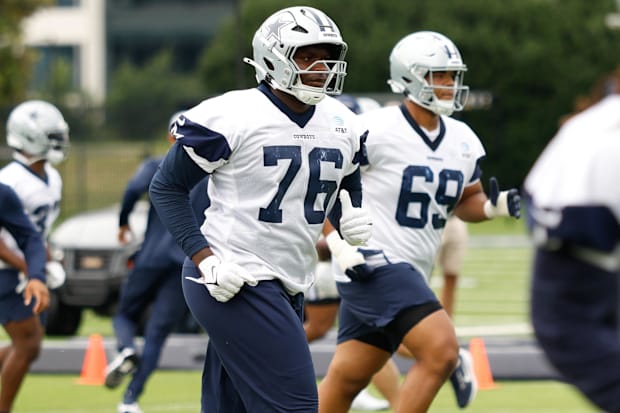 Dallas Cowboys offensive tackle Asim Richards and Ajani Cornelius go through a drill during practice at the Ford Center.