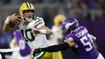 Green Bay Packers quarterback Jordan Love (10) is tackled by Minnesota Vikings linebacker Blake Cashman (51) in the fourth quarter during their football game Sunday, December 29, 2024, at U.S. Bank Stadium in Minneapolis, Minnesota.