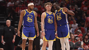 Apr 30, 2025; Houston, Texas, USA; Golden State Warriors forward Draymond Green (23) talks to guard Brandin Podziemski (2) and guard Moses Moody (4) before playing against the Houston Rockets in the second quarter during game five of first round for the 2025 NBA Playoffs at Toyota Center. Mandatory Credit: Thomas Shea-Imagn Images