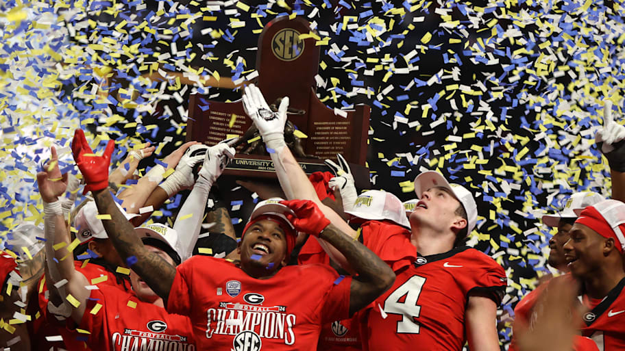 Georgia football players celebrate a win over Texas in the SEC championship.