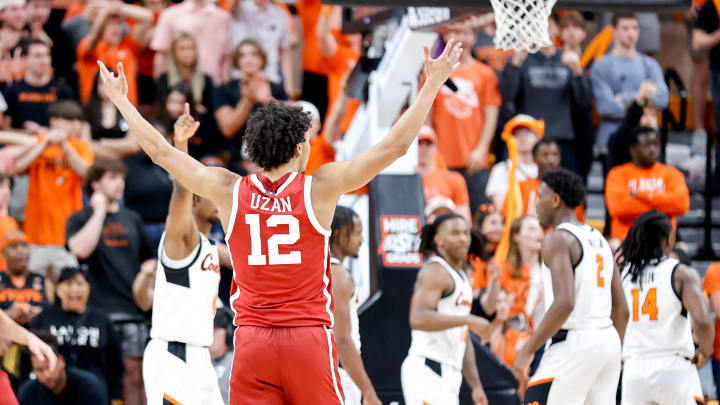 Oklahoma guard Milos Uzan (12) celebrates in overtime during an NCAA basketball game between Oklahoma and Oklahoma State in Stillwater, Okla., on Saturday, Feb. 24, 2024.