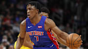 Jan 29, 2019; Detroit, MI, USA; Detroit Pistons forward Stanley Johnson (7) dribbles the ball past Milwaukee Bucks forward Giannis Antetokounmpo (behind) during the second quarter at Little Caesars Arena. Mandatory Credit: Raj Mehta-Imagn Images