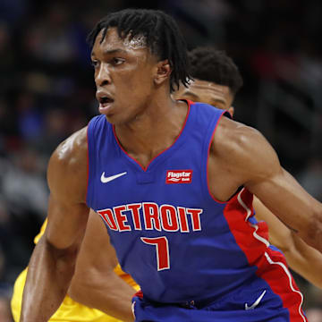 Jan 29, 2019; Detroit, MI, USA; Detroit Pistons forward Stanley Johnson (7) dribbles the ball past Milwaukee Bucks forward Giannis Antetokounmpo (behind) during the second quarter at Little Caesars Arena. Mandatory Credit: Raj Mehta-Imagn Images