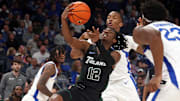 Feb 11, 2024; Memphis, Tennessee, USA; Tulane Green Wave guard Kolby King (12) drives to the basket during the second half against the Memphis Tigers at FedExForum. Mandatory Credit: Petre Thomas-Imagn Images