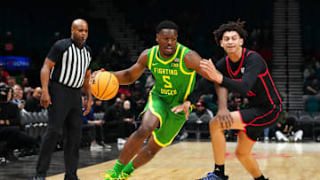 Nov 27, 2024; Las Vegas, Nevada, USA; Oregon Ducks guard TJ Bamba (5) dribbles against San Diego State Aztecs guard Miles Byrd (21) during the first half at MGM Grand Garden Arena. Mandatory Credit: Stephen R. Sylvanie-Imagn Images