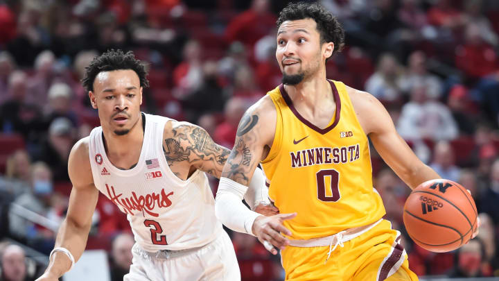 Minnesota guard Payton Willis (0) dribbles around Nebraska guard Trey McGowens (2) in the second half at Pinnacle Bank Arena in Lincoln, Neb., on Feb. 9, 2022. 