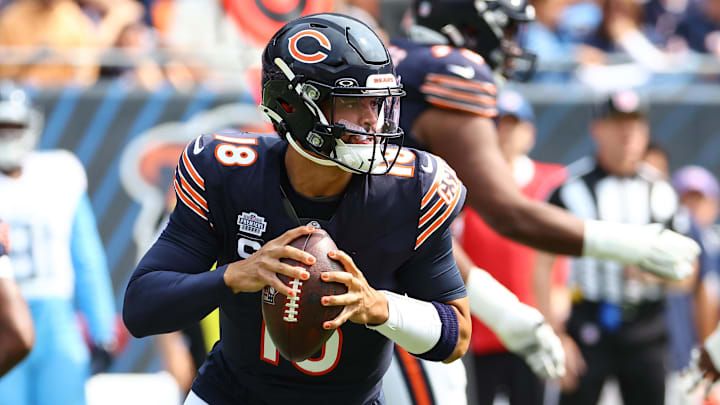 Sep 8, 2024; Chicago, Illinois, USA; Chicago Bears quarterback Caleb Williams (18) drops back to pass against the Tennessee Titans during the second quarter at Soldier Field. Mandatory Credit: Mike Dinovo-Imagn Images