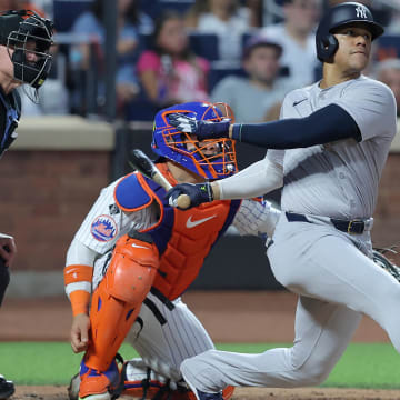 Jun 25, 2024; New York City, New York, USA; New York Yankees right fielder Juan Soto (22) follows through on a solo home run against the New York Mets during the fifth inning at Citi Field. Mandatory Credit: Brad Penner-USA TODAY Sports